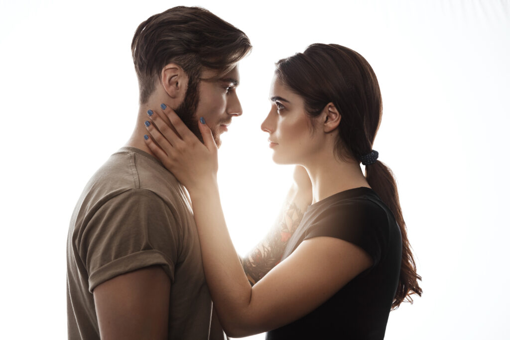 closeup of young nice couple looking at each other.